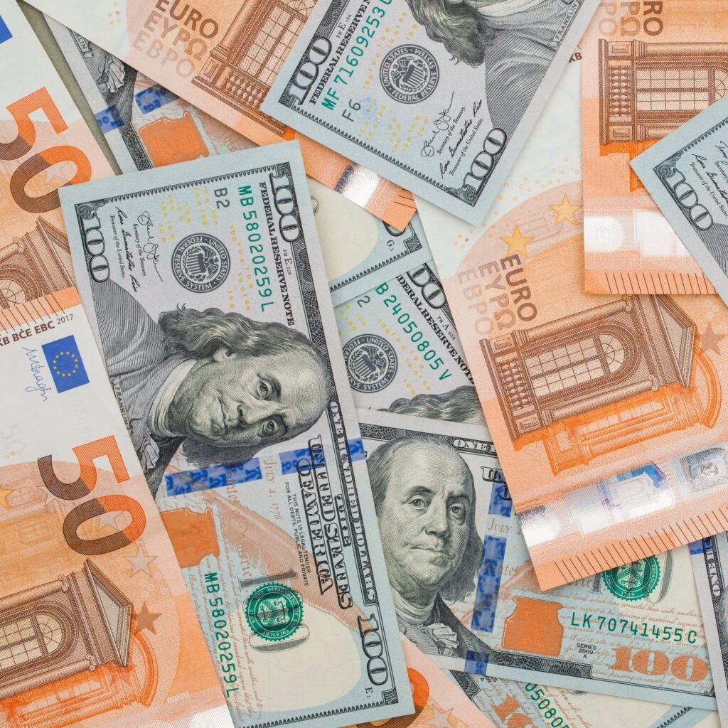Financial accounting concept with euro and dollar bills flat lay. Financial accounting concept with euro and dollar bills flat lay.