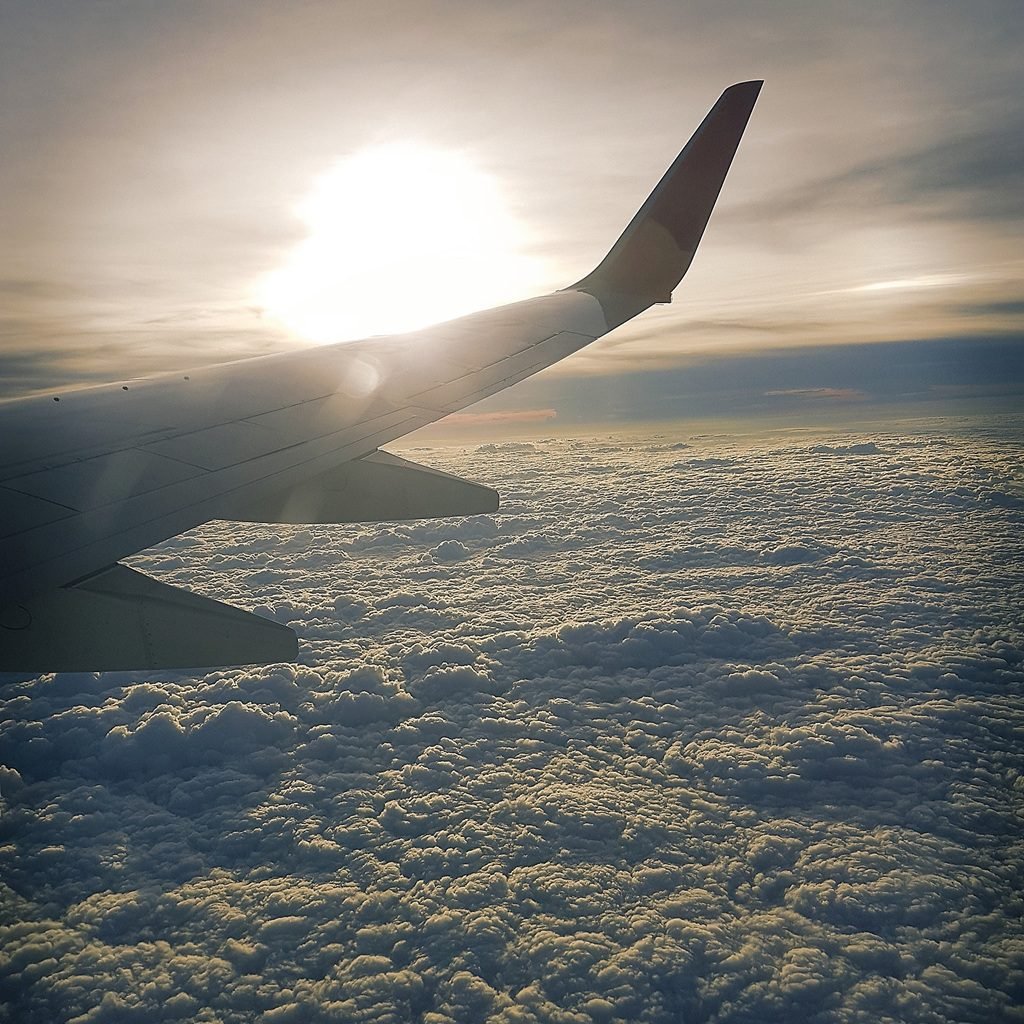 Airplane flying over the clouds